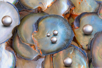 A few pearls in a heart-shaped oyster shell