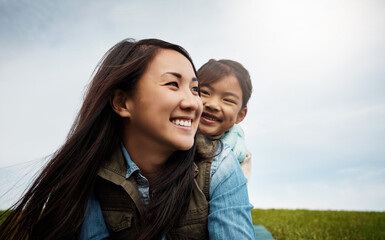 Happy mom, kid and piggyback with freedom in nature for bonding, holiday or outdoor weekend. Asian mother carry girl, child or daughter with smile for adventure, embrace or childhood at park outside