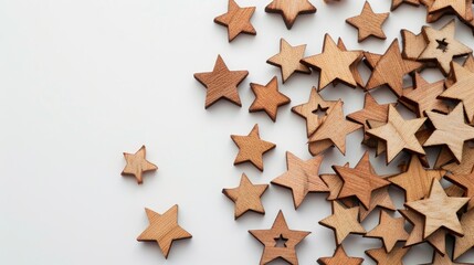 Many wooden stars on white backdrop with available space
