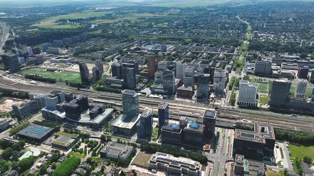 Aerial of Amsterdam with the financial business center known as the South Axis - Zuid As by helicopter