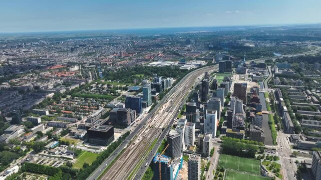 Aerial of Amsterdam with the financial business center known as the South Axis - Zuid As by helicopter