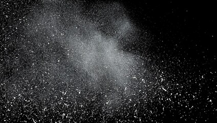 White dust exploding on a black background