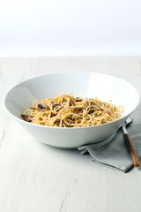 Bowl with spaghetti and mushrooms