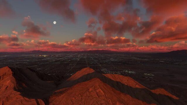 Side aerial drone view at sunset of Frenchman Mountain and Las Vegas City in Sunrise Manor - Nevada. United States