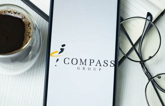 New York, USA - 21 June 2024: Compass Group Logo on Phone Screen, Company Icon