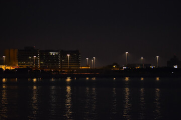 Obraz premium The view of Tung Chung Promenade, Hong Kong, at night. Night cityscape.