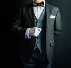 Butler or Hotel Concierge in Formal Attire and White Gloves Eager to Be of Service. White Glove Service and Professional Hospitality.