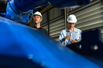 Robotic engineer men working in inventory factory
