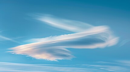 A single cloud formation with interesting shapes, capturing the ever-changing nature of the sky.