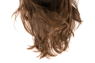 Naklejka premium Long human brown hair isolated on background. hair texture close up