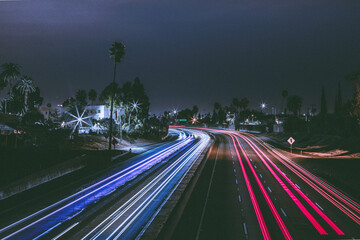 Long exposure of a freeway in los angeles california making the continuous lights of the cars in...