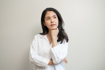 asian woman in casual dress thinking and imagination isolated on background