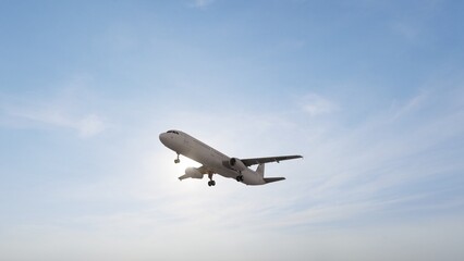 Airplane in the sky at sunset. Air transportation. Travel. Airplane Takes Off Against the Background of Blue Sky.	
