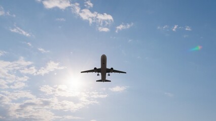 Airplane in the sky at sunset. Air transportation.  Travel. Airplane Takes Off Against the Background of Blue Sky. 