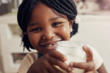 Black girl, drink milk and portrait in home for nutrition, hygiene and dental health in kitchen....