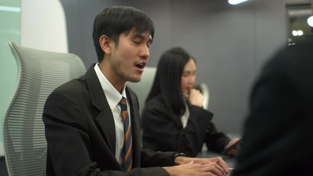 Disappointed stressed employee when talking with manager while meeting with diverse colleagues in modern office, depressive work with dissatisfied executive complaining on business project. 
