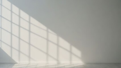 Obraz premium A minimalist photograph of a white wall with soft shadows cast by a nearby object. The simplicity and uniformity create a serene atmosphere.