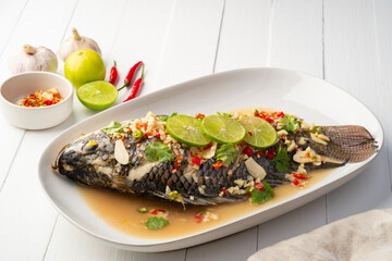 Steamed Tilapia Fish In Spicy Lime Soup.Thai food