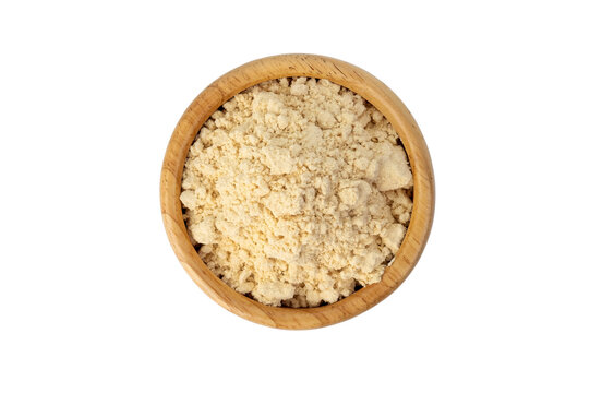 instant soy milk powder in wooden bowl isolated on white background with clipping path.Top view