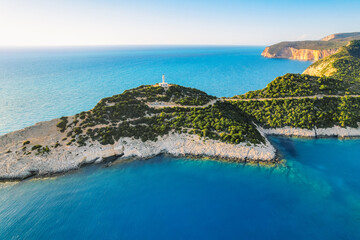 Lighthouse on the cliff. Seascape of Cape Lefkatas with old lighthouse on Lefkada island, Greece....