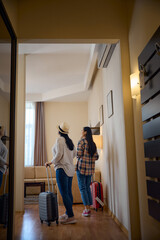 Two tourists looking around in their suite on arrival