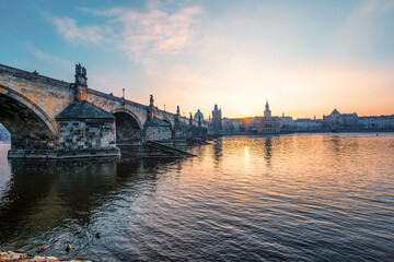 Fototapeta premium View of the city of Prague and the Vltava river with Old Town Bridge Tower on Charles bridge in Prague, Czech Republic.