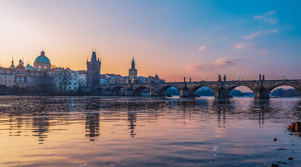 View of the city of Prague. Vltava river with Old Town Bridge Tower on  Charles bridge  in Prague,...
