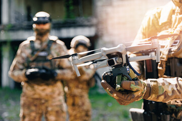 Military operator use rc for controls FPV UAV drone with device for releasing mines and grenades to...