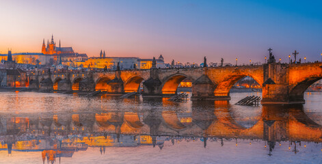 View of the city of Prague castle in hradcany and the Vltava river with Charles bridge in Prague, Czech Republic.