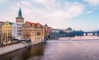 View of the city of Prague and the Vltava river with Old Town Bridge Tower on  Charles bridge  in Prague, Czech Republic.