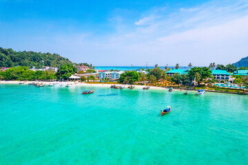 longtail boat turquoise clear water in Phi Phi, Krabi Thailand. Amazing travel landscape photo in...