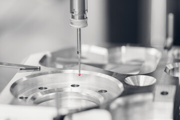 Quality control of drilling CMM in car engine. Milling CNC machinery with coordinate measuring...