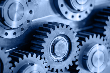 Macro photo metal engine gear wheels. Industrial background blue toning, concept fix service of car