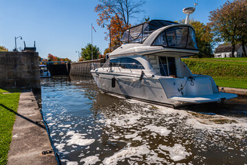 Boats passing through a lock on the rideau canal in Ontario, Canada - a world heritage site