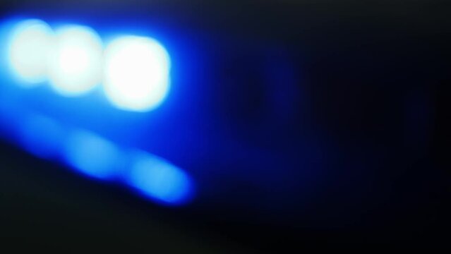 Defocused view on red and blue flasher on roof police or car of emergency service.