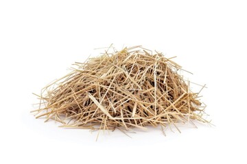 A pile of hay sits atop a white surface, perfect for agricultural or rustic-themed uses