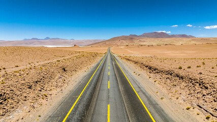 Atacama Desert in Chile. Aerial view. Route 27, road during a car trip. Salar de Loyoques.