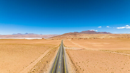 Atacama Desert in Chile. Aerial view. Route 27, road during a car trip. Salar de Loyoques.