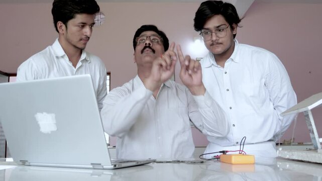 Teacher Guiding Student on there project in Lab , Teacher helping student in there project in lab with Problems and Solutions