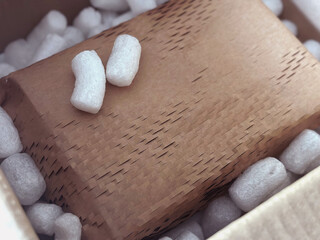 Secure Shipment. Eco packaging of parcels and white soft filler.