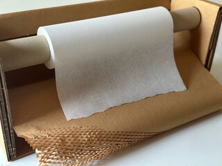 Safe Shipping Solutions. Packing paper for parcels and goods. Delivery of goods, parcels, delivery service, nature protection and recycling concept. Packed with Care