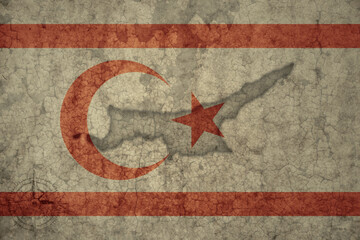 map and flag of northern cyprus on a old vintage crack paper background .