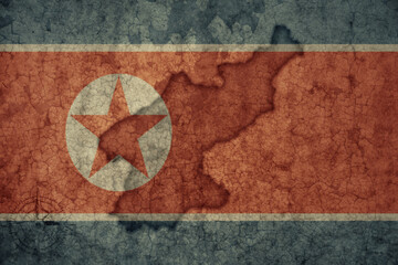 map and flag of north korea on a old vintage crack paper background .