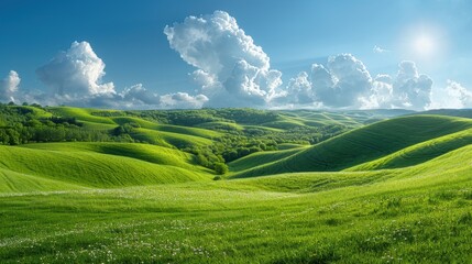 Obraz premium A serene landscape of lush green rolling hills under a bright blue sky with scattered clouds, capturing the essence of nature's tranquility.