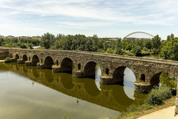 Fototapeta premium Ancient Roman Bridge Over Guadiana River in Merida, Spain
