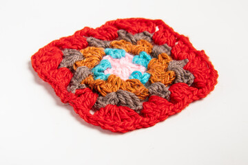 Crochet granny square on white background. Crochet