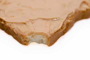 Single Bite Out of a Peanut Butter Bread Slice
