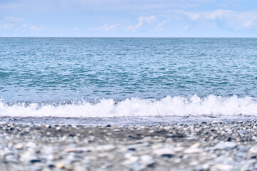 A natural landscape overlooking a beautiful tropical beach and the sea on a sunny day. The sea horizon with space to copy. High quality photo