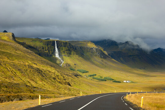 Dramatic Icelandic landscape with a remote waterfall