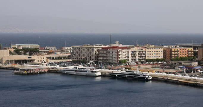 Messina Sicily Italy fast ferry boats Yachts port. Largest passenger port in the Mediterranean Europe. Harbor city. Navy Coast Guard base. Historical buildings and churches. Tourism travel.